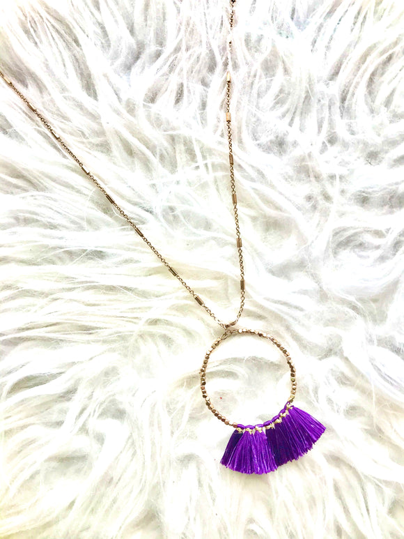 Purple fringe necklace on gold